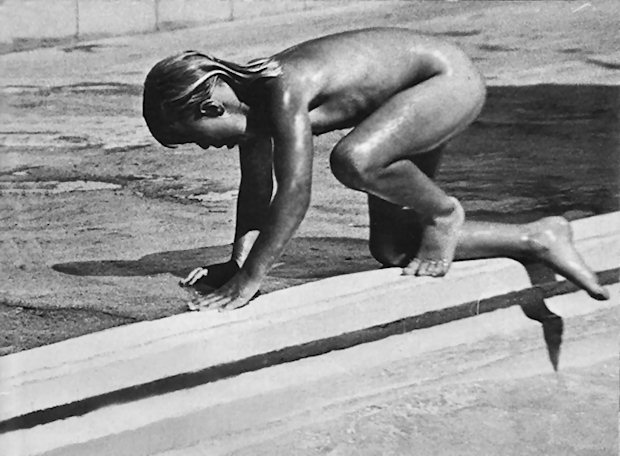 Girl climbs from a pool