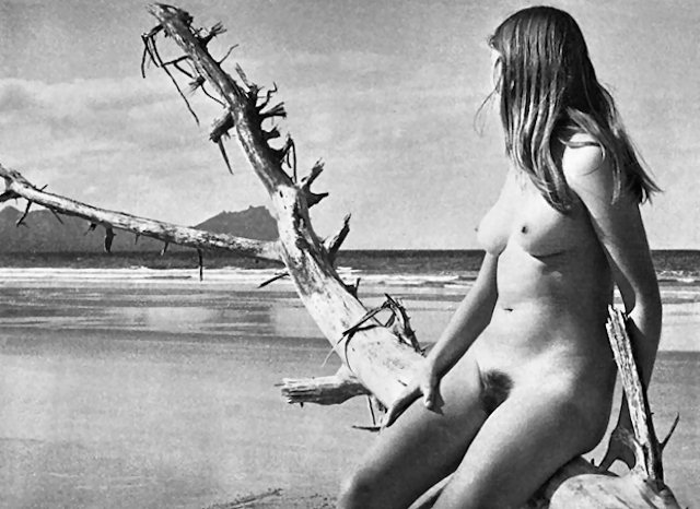 Girl on a log at Uretiti