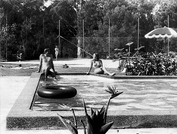 Couple chatting by the pool