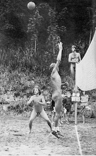 Three boys chatting at a camp