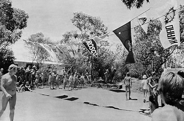 Two girls pushing a tank